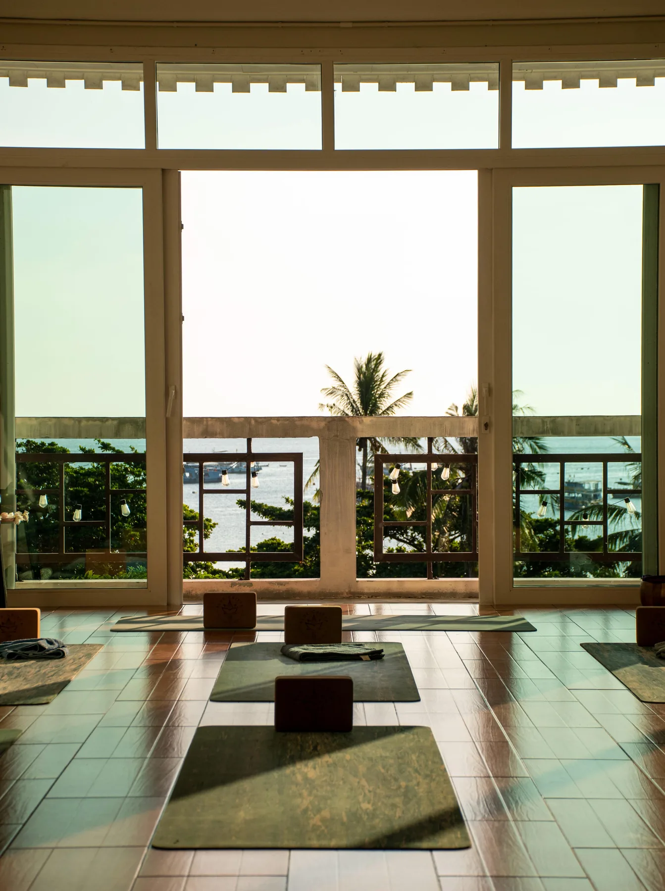 The empty sea-view shala with its doors open onto the water